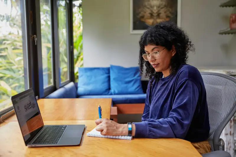 A woman comparing options on her laptop